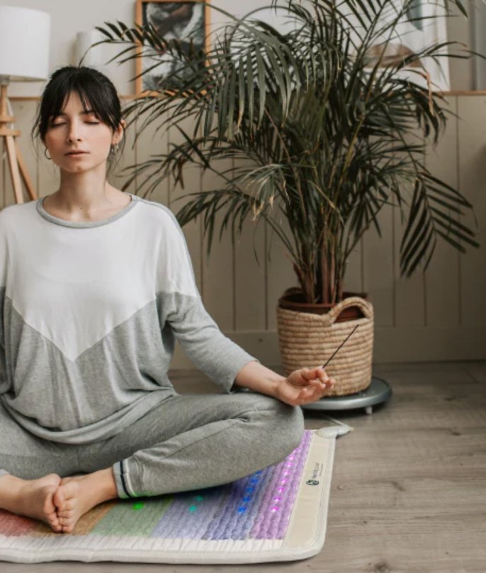 women sitting on healthy wave mat